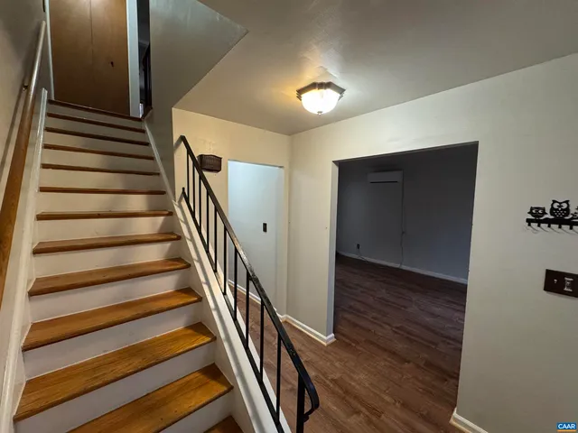 a view of entryway with wooden floor