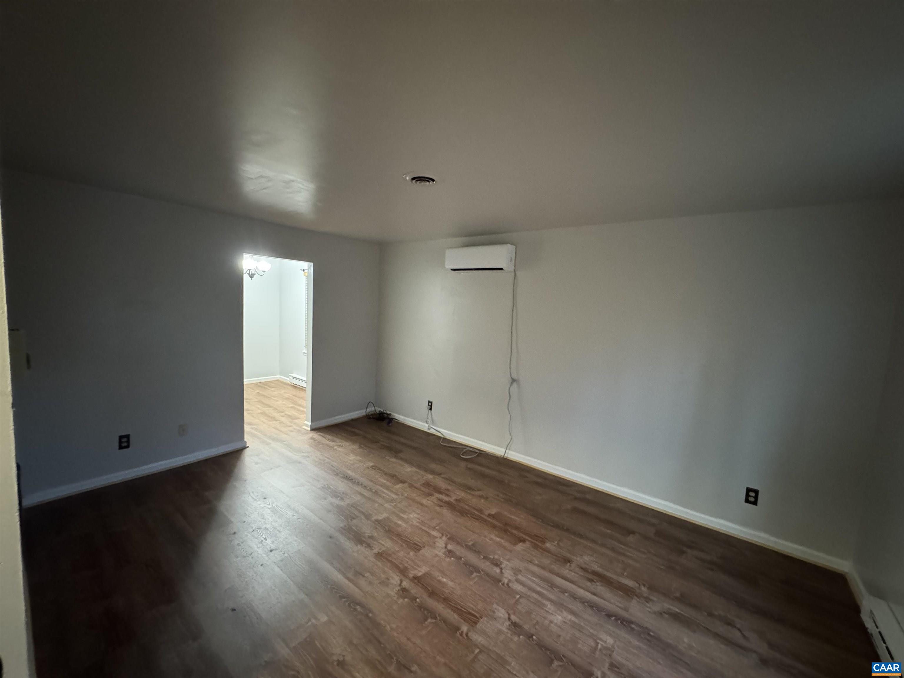 2508 Naylor Street Charlottesville, VA 22903 - Photo 4 of 5 an empty room with wooden floor
