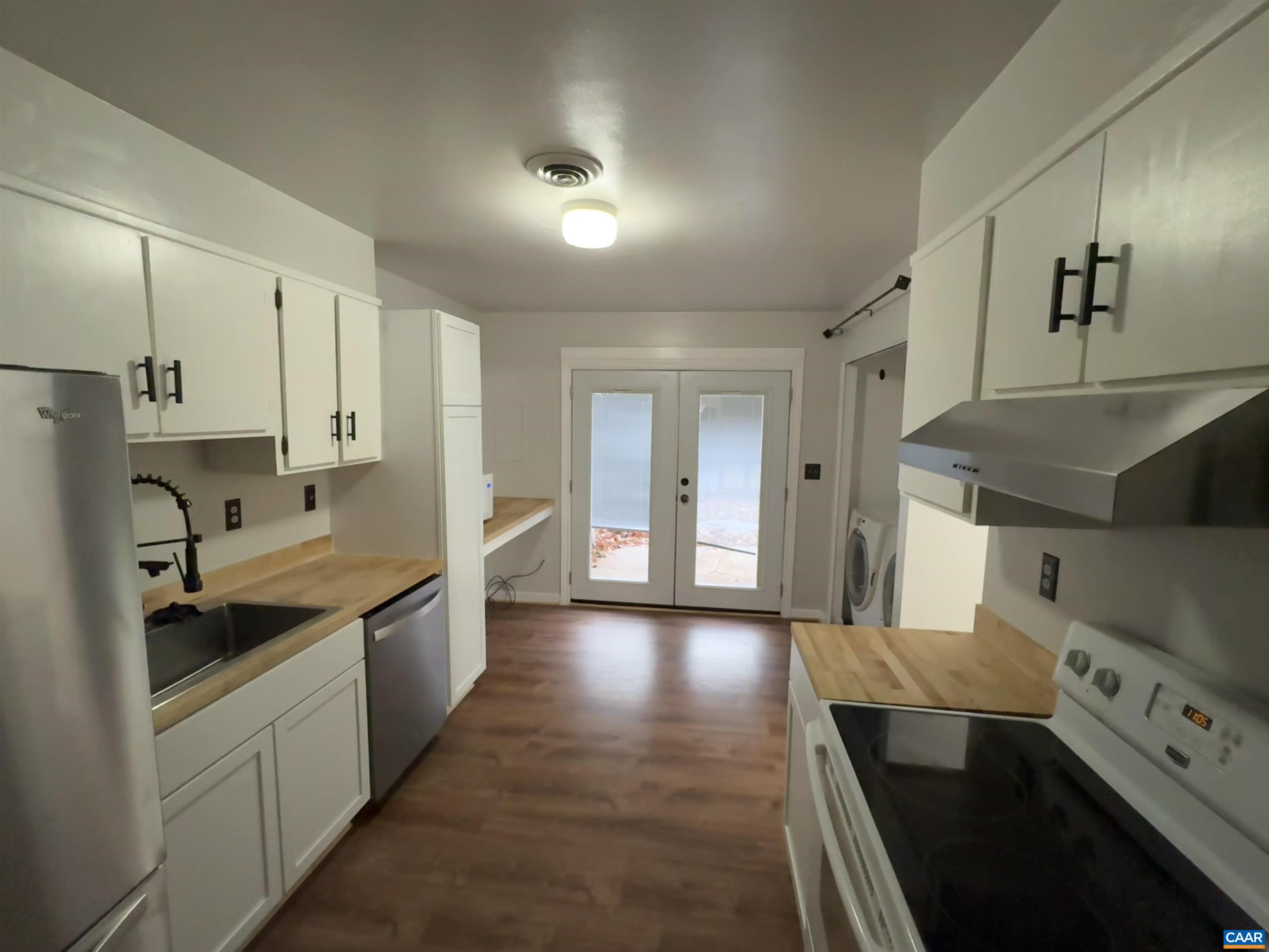 2508 Naylor Street Charlottesville, VA 22903 - Photo 5 of 5 a kitchen with stainless steel appliances granite countertop a sink stove and refrigerator