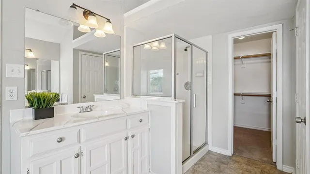a bathroom with a double vanity sink and a mirror