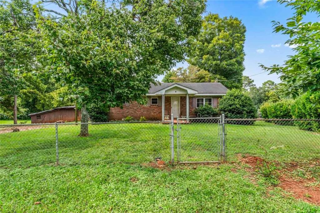 25 Roberts Road Covington, GA 30016 - Photo 1 of 1 a view of a house with a backyard