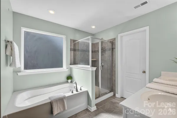 a bathroom with a tub and sink