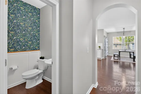 a bathroom with a toilet a sink and a window