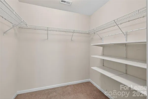 a view of an empty walk in closet