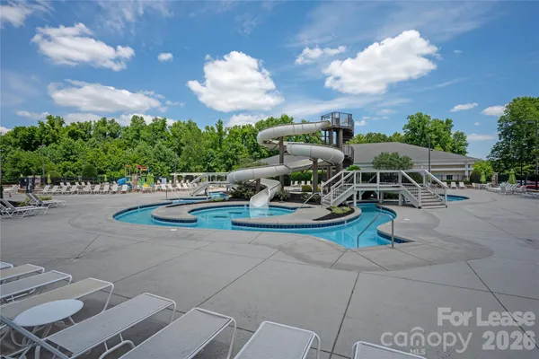 a view of a backyard with sitting area