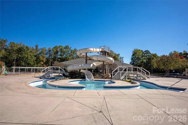 a view of a patio with swimming pool