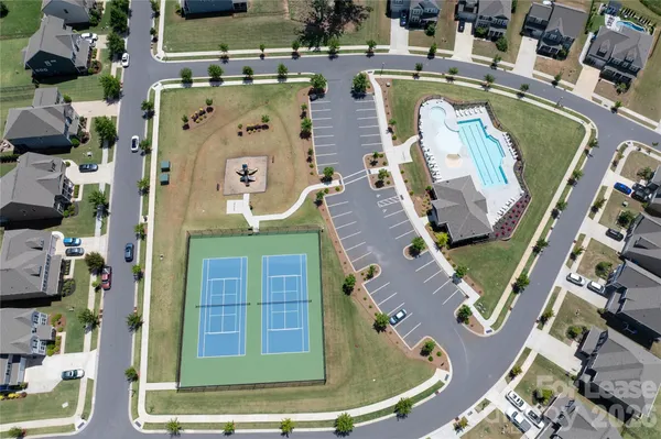 an aerial view of a house with a swimming pool