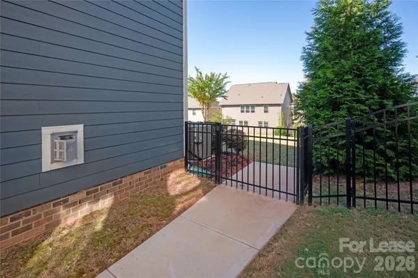 a view of a house with a fence