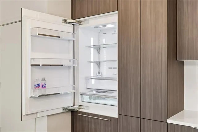 a kitchen with a stove a sink and a refrigerator