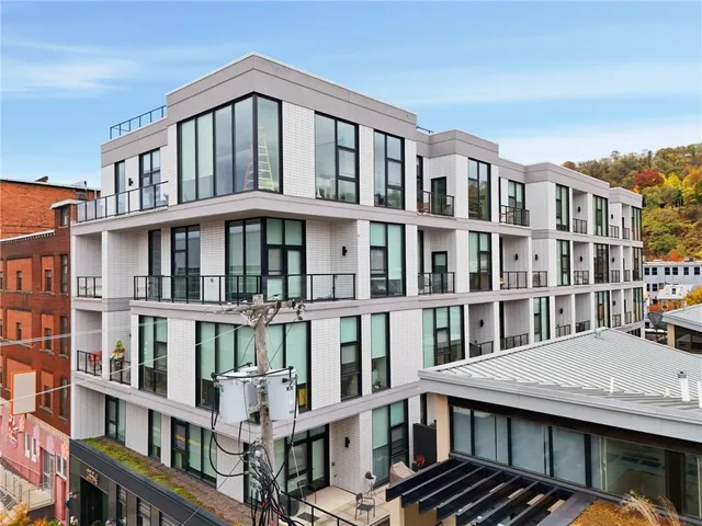 a front view of a building with glass windows