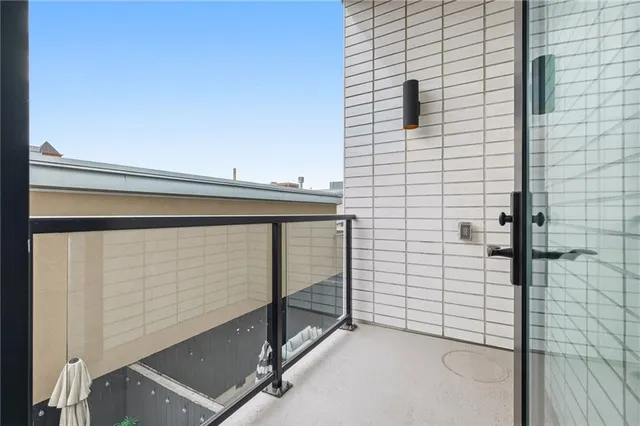 a view of a hallway with a white walls