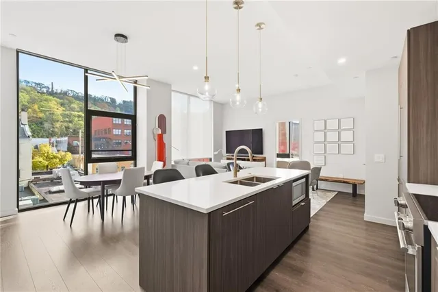 a kitchen with a sink and a refrigerator