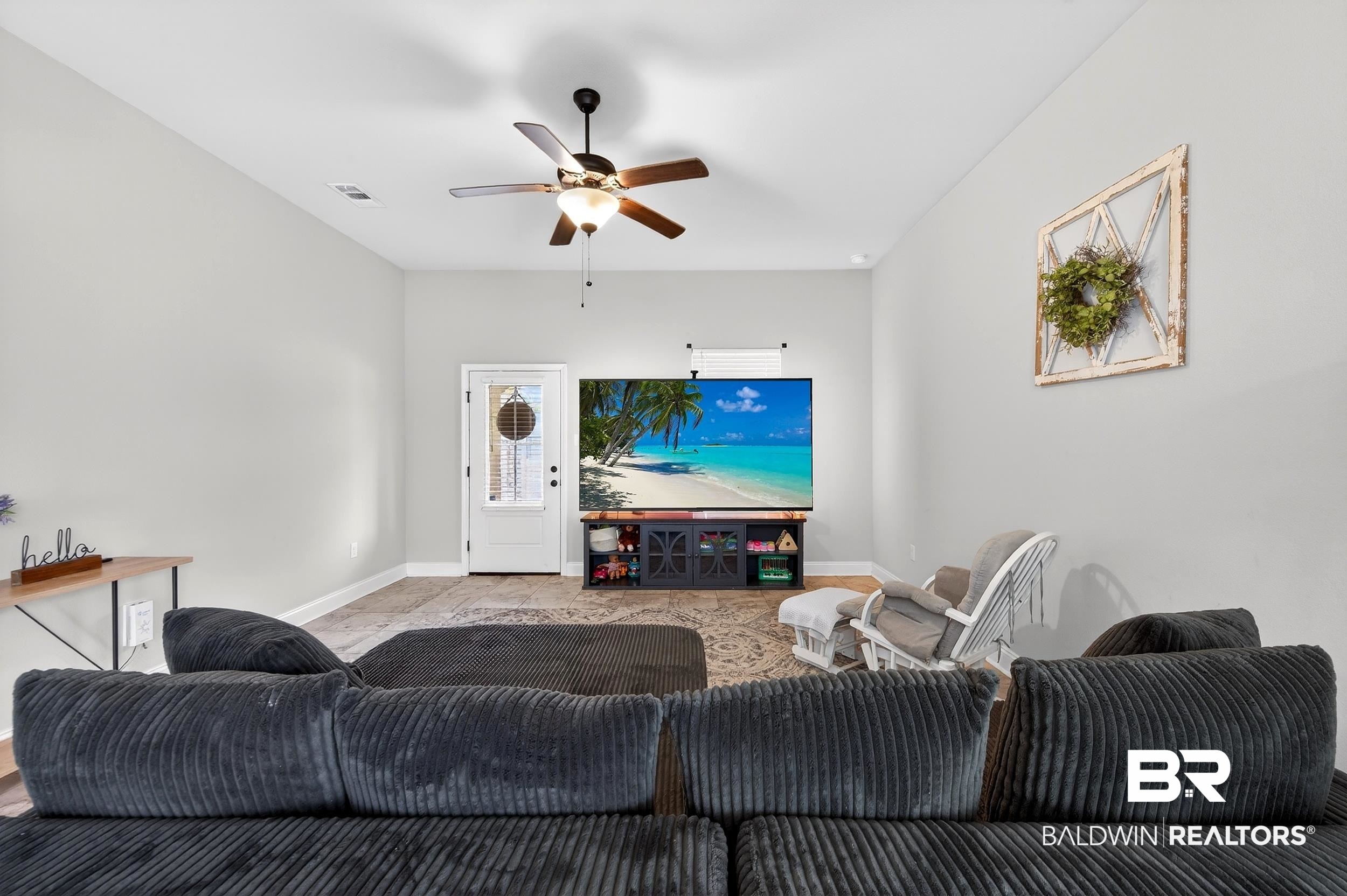 1084 Stella Road Foley, AL 36535 - Photo 7 of 31 Living area featuring ceiling fan and baseboards