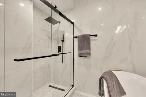 a bathroom with a shower and a sink