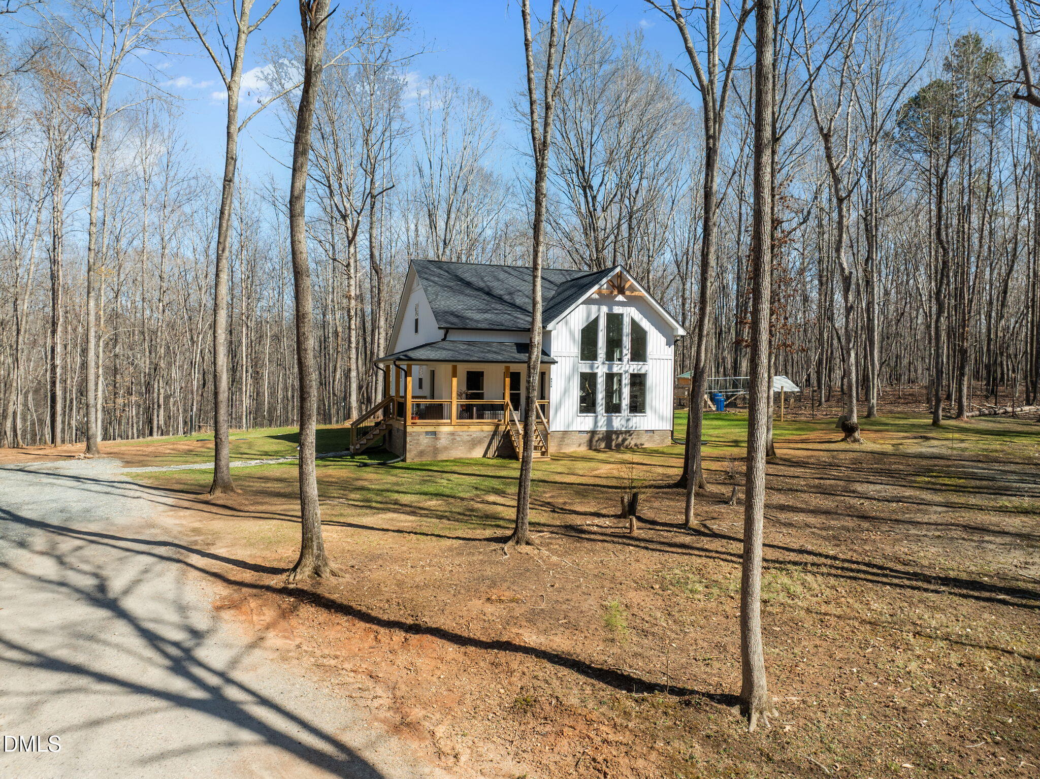 8514 Charlie Stovall Road Roxboro, NC 27574 - Photo 1 of 48 a view of a house with a yard and large trees
