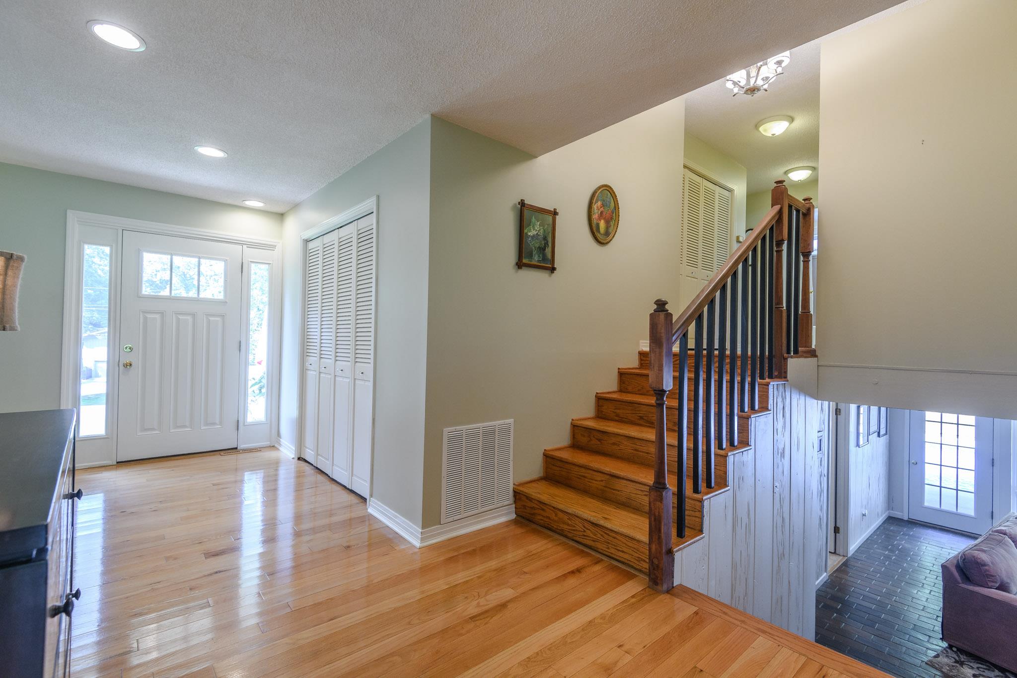 Inviting foyer with hardwood flooring