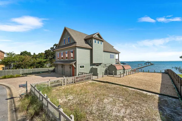 a bed room with a bed and a chandelier