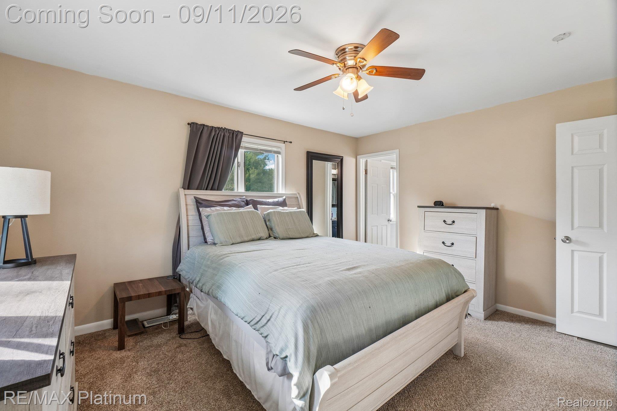 12126 Linden Road Linden, MI 48451 - Photo 13 of 38 Neutral-toned walls complement the window with dark drapery