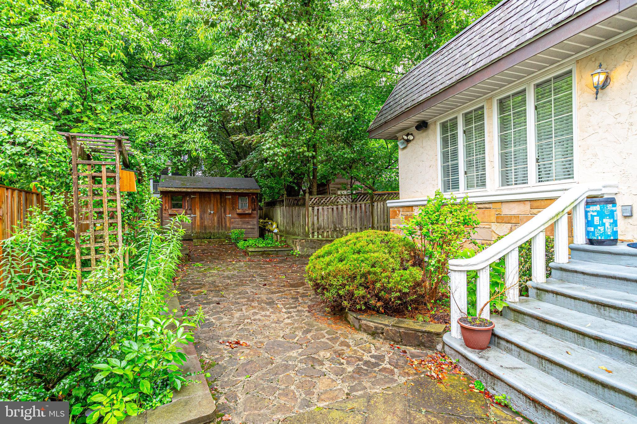 8212 Old Georgetown Road Bethesda, MD 20814 - Photo 47 of 49 Secret garden with entryway to entertaining space.