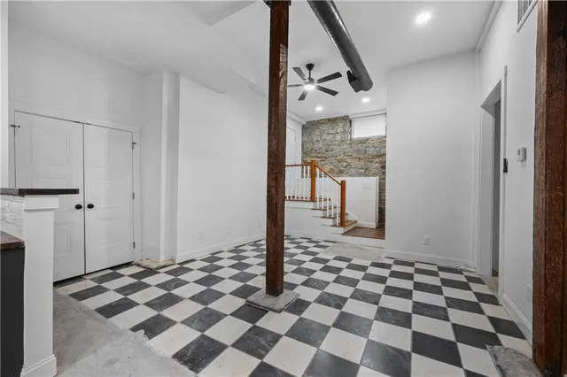 a view of a entryway with a checkered floor and a black and white checkered floor