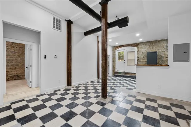 a bathroom with a checkered floor and a black white checkered floor