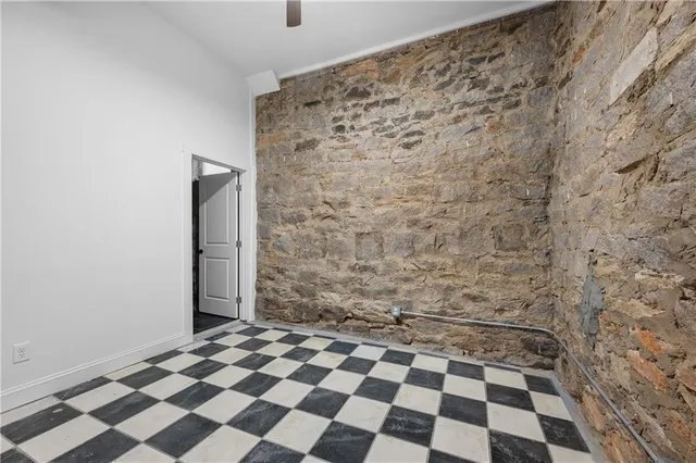 a bathroom with a checkered floor