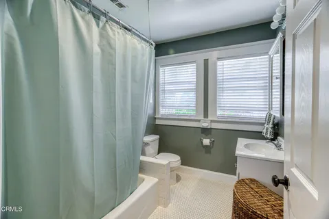 a bathroom with a sink and a window