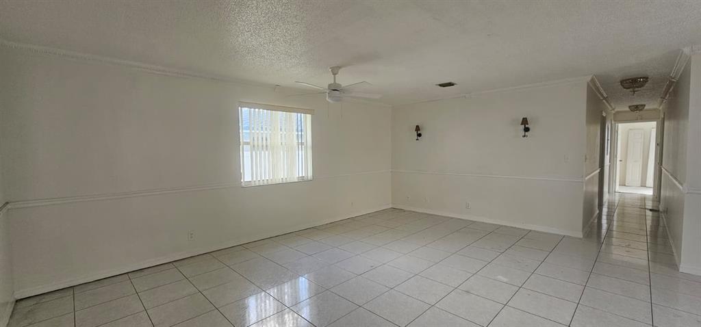 5580 Plunkett Street Hollywood, FL 33021 - Photo 6 of 13 an empty room with windows