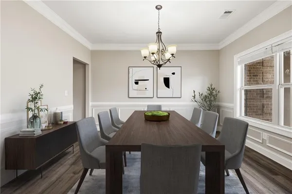 an empty room with wooden floor a fireplace a ceiling fan and windows