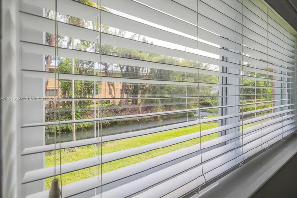 a view of a room with a large window