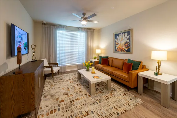 a living room with furniture and a flat screen tv