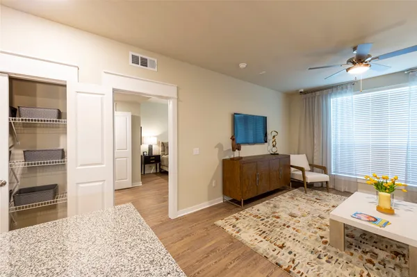 a living room with furniture and a flat screen tv