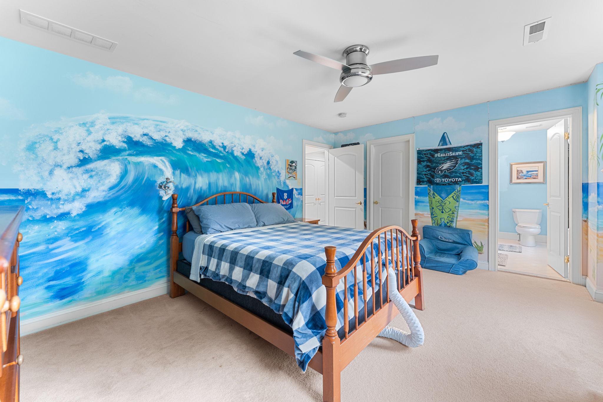 912 Ashbourne Way Schwenksville, PA 19473 - Photo 26 of 45 Coastal-themed bedroom with wave mural.