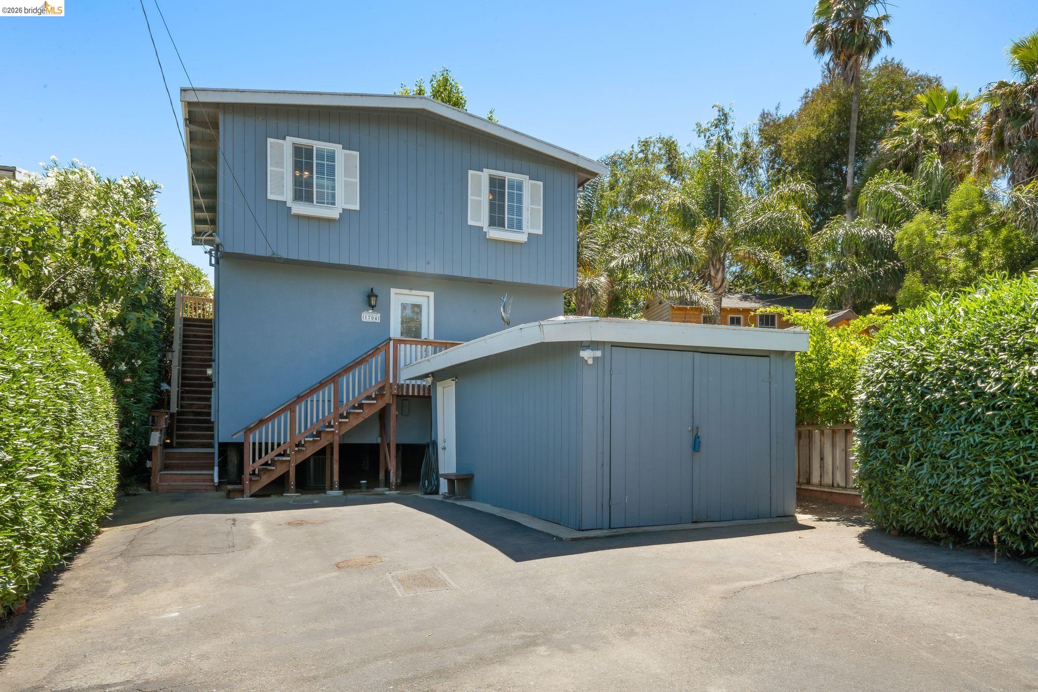 1704 Taylor Road Bethel Island, CA 94511 - Photo 1 of 73 Two-story residence featuring light blue siding and white window shutters
