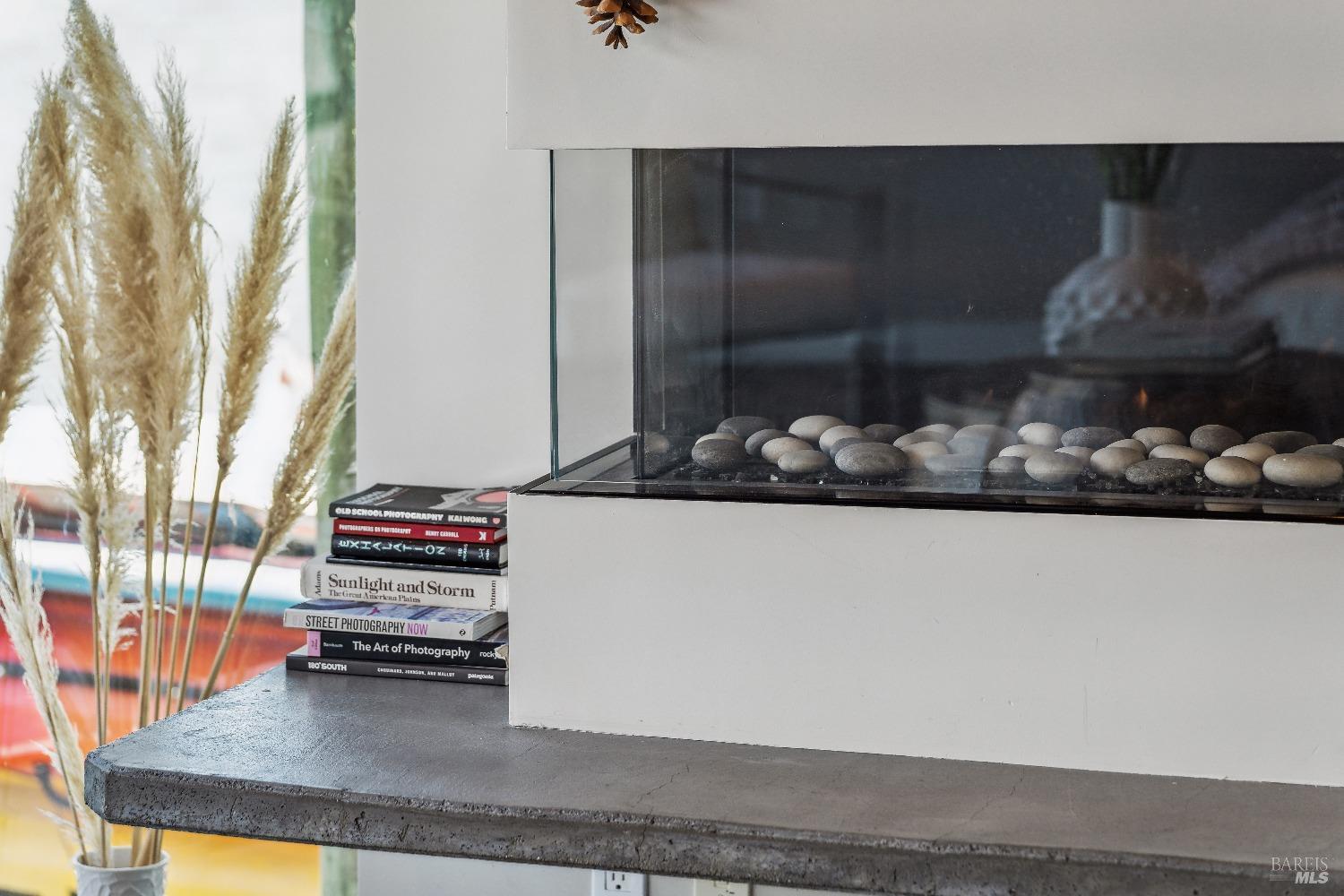 15 Gate 6 1/2 Road Mill Valley, CA 94941 - Photo 12 of 33 a view of a livingroom with wooden floor and a fireplace