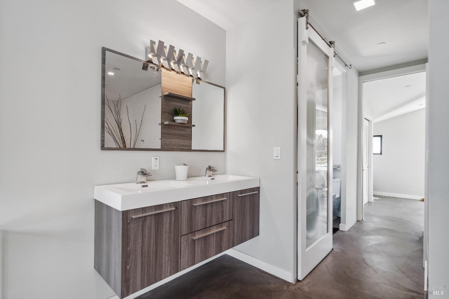 15 Gate 6 1/2 Road Mill Valley, CA 94941 - Photo 21 of 33 a en suite bathroom with a double vanity sink and a mirror
