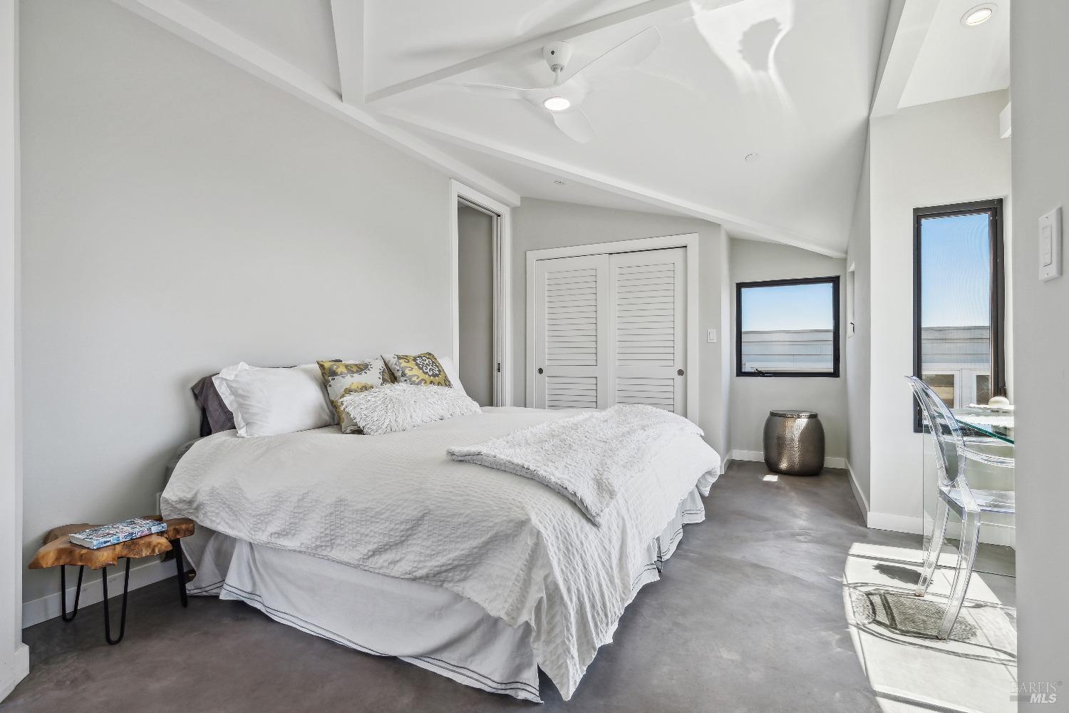 15 Gate 6 1/2 Road Mill Valley, CA 94941 - Photo 22 of 33 a spacious bedroom with a bed and wooden floor