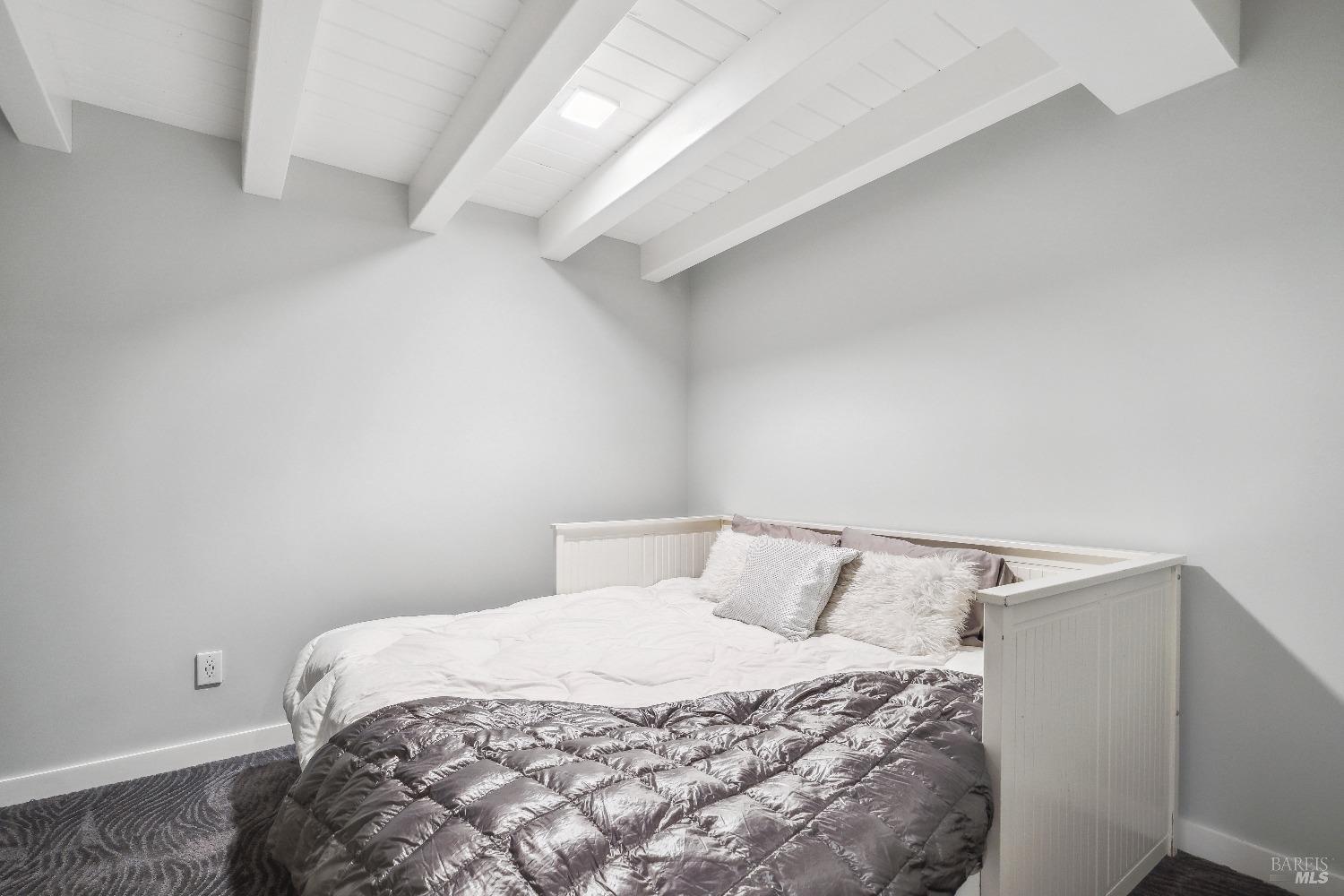 15 Gate 6 1/2 Road Mill Valley, CA 94941 - Photo 28 of 33 a bedroom with a bed and wooden floor