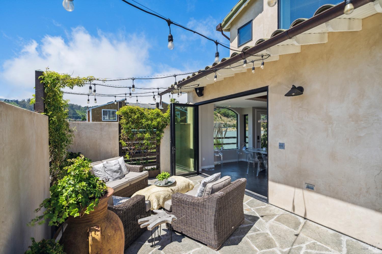 15 Gate 6 1/2 Road Mill Valley, CA 94941 - Photo 4 of 33 a front view of a house with outdoor seating and lots of potted plants