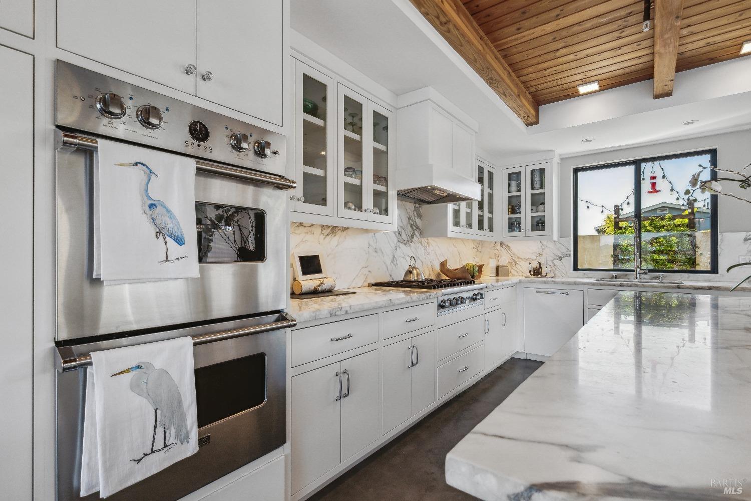 15 Gate 6 1/2 Road Mill Valley, CA 94941 - Photo 6 of 33 a kitchen with stainless steel appliances granite countertop a refrigerator a stove and a sink with cabinets
