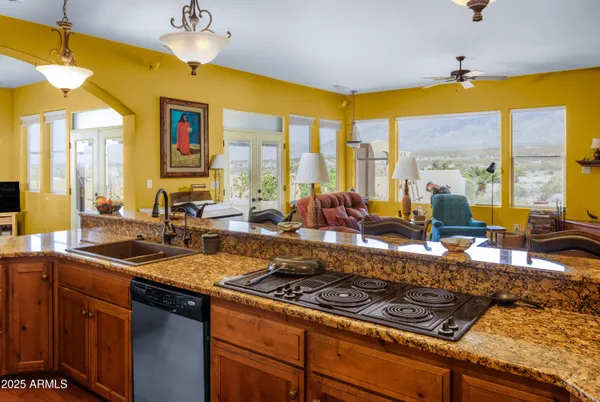 a room with lots of books and a wooden floor