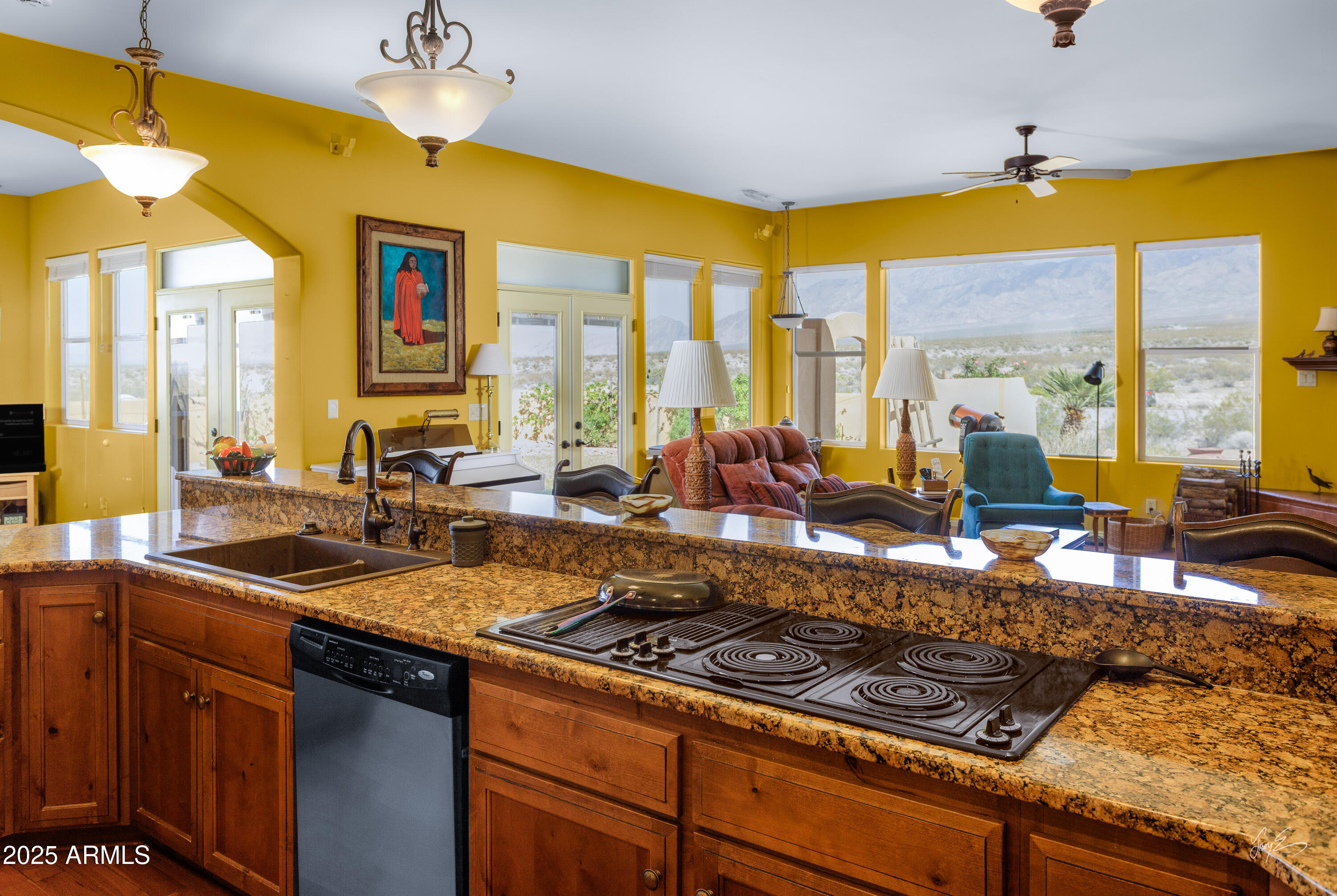 2601 South Frehner Road Littlefield, AZ 86432 - Photo 8 of 32 a kitchen with a large window cabinets and stainless steel appliances
