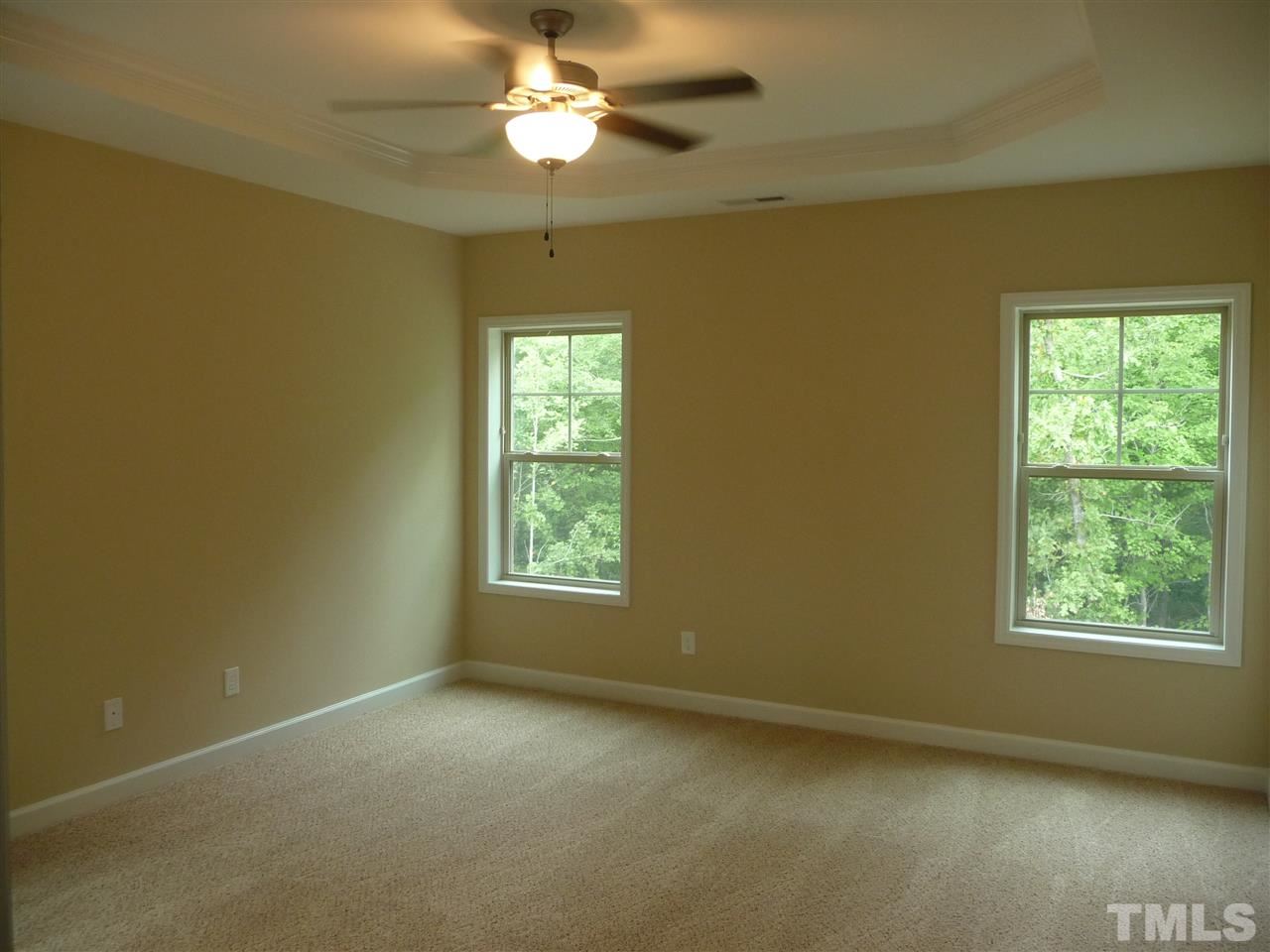1304 Ranchester Road Knightdale, NC 27545 - Photo 15 of 18 Trey ceiling, walk-in closet and rear tree view!