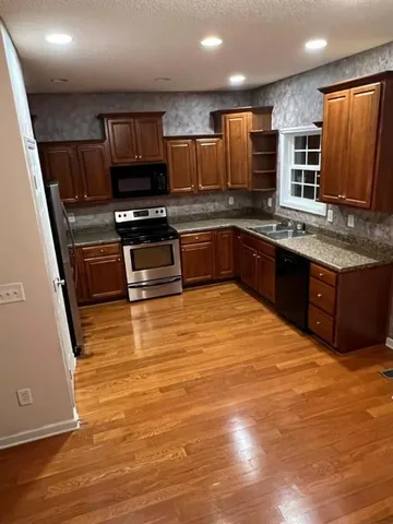 a view of entryway with wooden floor