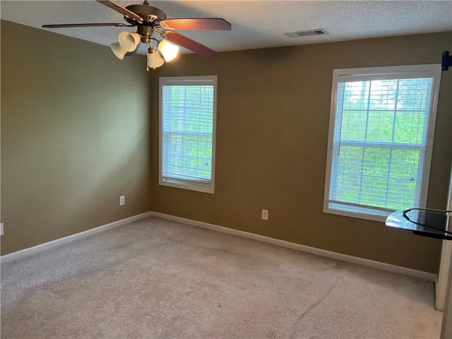 a bathroom with a double vanity sink and mirror