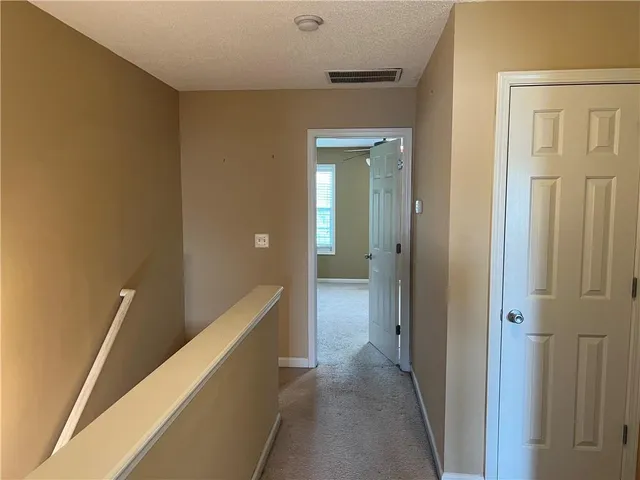 a bathroom with a sink a toilet a mirror and shower