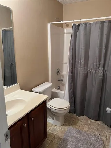 a view of a room with wooden floor and staircase