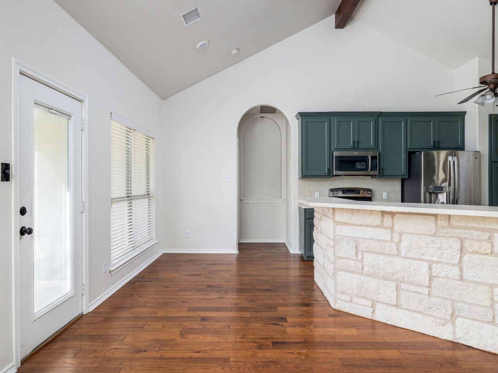 2209 Lark Lane Taylor, TX 76574 - Photo 11 of 25 a kitchen with stainless steel appliances a refrigerator sink and microwave