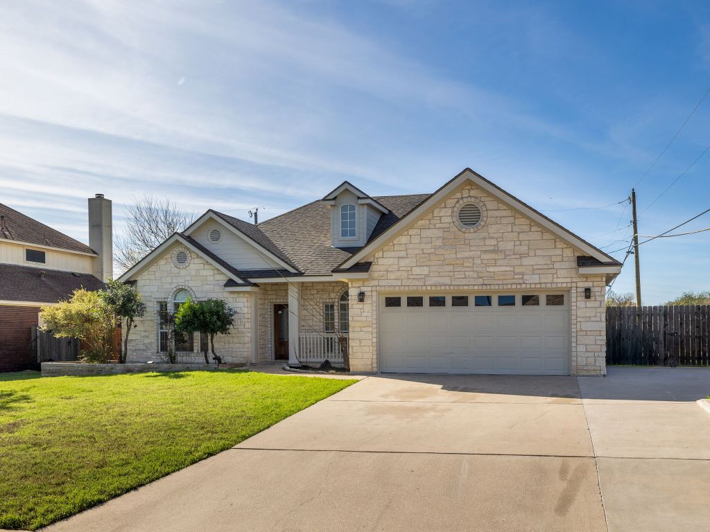2209 Lark Lane Taylor, TX 76574 - Photo 2 of 25 front view of a house with a yard