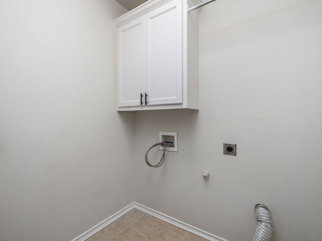 2209 Lark Lane Taylor, TX 76574 - Photo 24 of 25 a bathroom with a sink